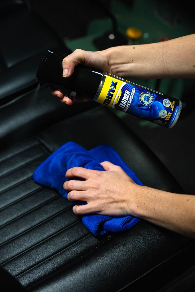 Someone using the  rain-X leather cleaner